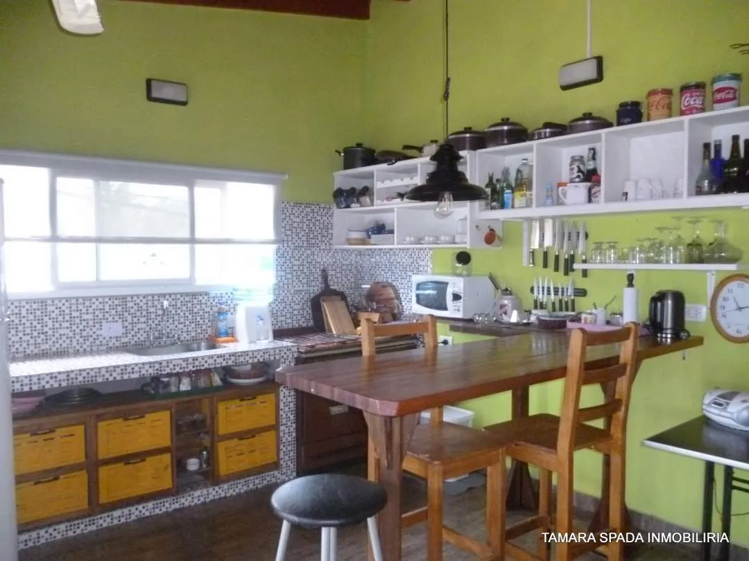 LOCAL CON VIVIENDA SOBRE AV 33