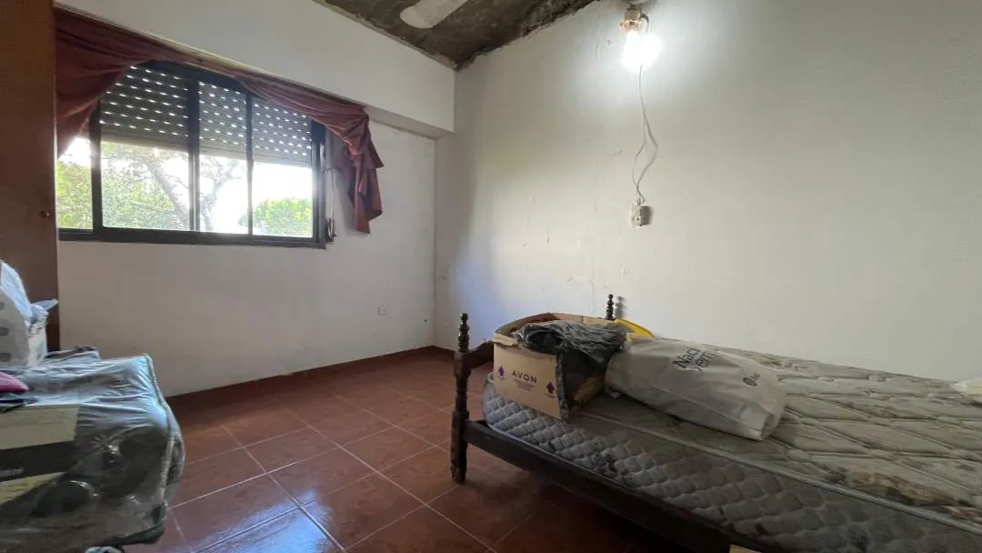 CASA SOLA EN LOTE CON LOCAL  DE 30m2 ¡FRENTE A LA RUTA!